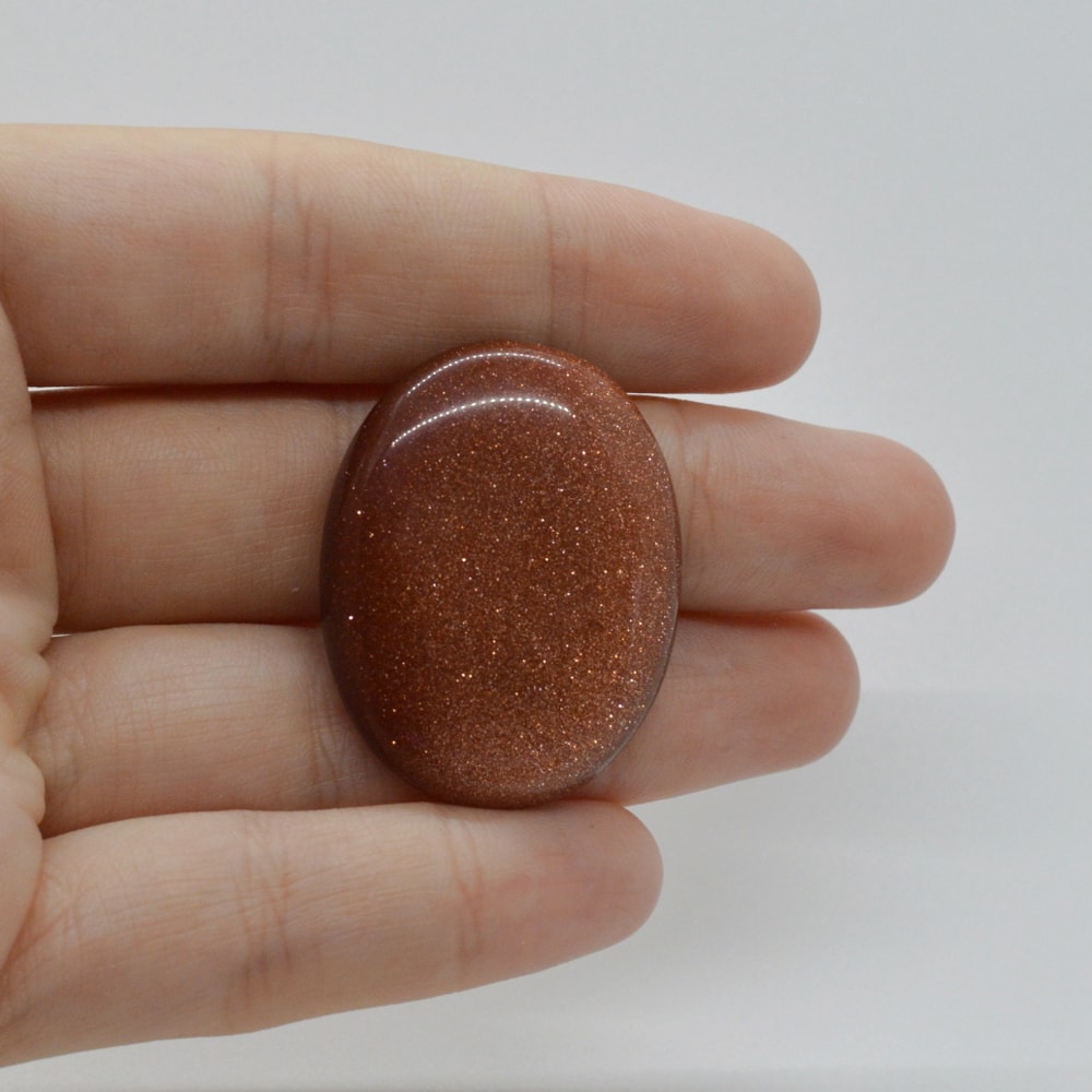 Cabochon goldstone maro 34x27x6mm c64